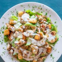 Caesar Salad With Grilled Chicken · crisp romaine lettuce tossed with our creamy Caesar dressing, parmesan cheese, and croutons....