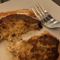 Creole Crab Cake · Blue Crab meat mixed with Fresh Herbs and Spices. Fried to a Crisp Brown and topped with a C...