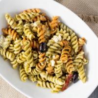Olive & Basil Pasta Dish · Delicious rigatoni pasta with house-made pesto sauce topped with feta cheese, kalamata olive...