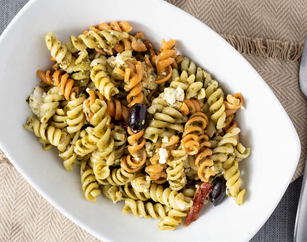 Olive & Basil Pasta Dish · Delicious rigatoni pasta with house-made pesto sauce topped with feta cheese, kalamata olives and sun-dried tomatoes.