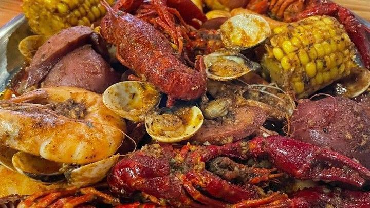 The Ultimate Feast Combo · 1 lb snow crab, one lobster tail (1 piece), 1 lb shrimp (head off), one lb crawfish, one lb black mussel, 1/2 lb green mussel, 1/2 lb sausage, come with three corn and three potatoes. No substitution.