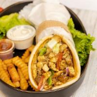Chicken Gyro Wrap · Chicken marinated gyro cubes on a pita bread with lettuce, tomatoes, onions, and cilantro gr...