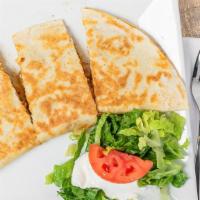 Quesadillas · Flour tortilla stuffed with choice of meat and cheese. Lettuce, sour cream and a tomato slic...