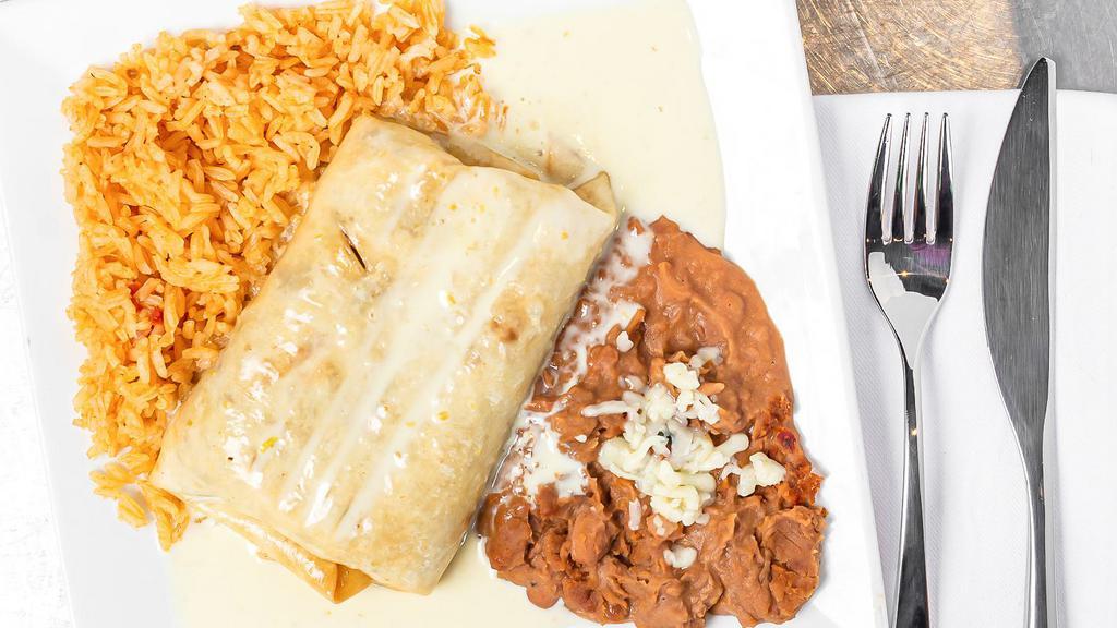 Chimichangas · Fried or soft, choice of meat, alongside Spanish rice and refried beans.