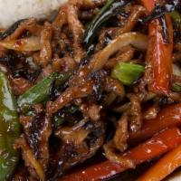 Garlic Pork · Spicy.
Pork with onions & bell pepper sautéed in a delicious, savory garlic sauce.
