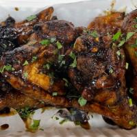 Jerk Chicken Wings · Jamaican jerk sauce; green onions.