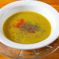 Dahl Soup · Delicious homemade lentil soup seasoned with garlic, peppers and served with fresh lemon.