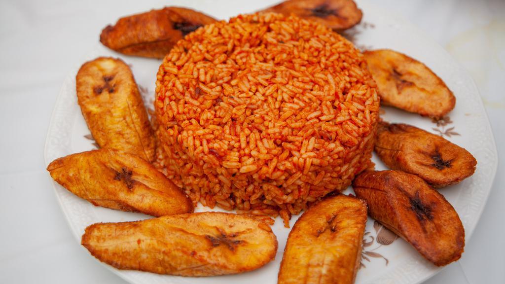Jollof Rice · Seasoned rice cooked in tomato and bell pepper puree. no meat included.