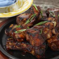 Chipotle Smoked Ribs (9) · 9 Slow roasted baby back ribs, chargrilled and basted with our spicy chipotle BBQ sauce.