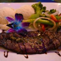 Churrasco · Grilled steak topped with our house made white garlic, cajun or red criolla sauce. Served wi...