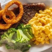 New York Strip Steak Platter · 12-ounce steak grilled and seasoned with onion ring and garnish.
