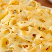 Fettuccine Alfredo · A large serving of fettuccine smothered in a creamy. Alfredo sauce topped with 3 cheese blen...