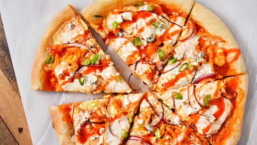 Buffalo Chicken Pizza · house made bleu cheese sauce, fried buffalo chicken,  mozzarella cheese, spicy ranch drizzle with green onions