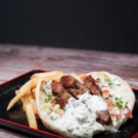 Lamb Gyro · Lamb, tzatziki sauce, cucumbers, and tomatoes on a pita bread. Served with one side.