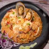 Arroz Con Mariscos · Seafood rice, mixed veggies, and sarsa criolla.
