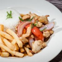 Pollo Saltado · Sauteed chicken strips with red onions and tomatoes. Served with white rice and fries.
