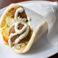 Falafel Gyro Wrap · Deep fried balls with tahini sauce. Served with lettuce, tomatoes, onions and pickles.