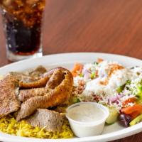 Lamb Gyro Plate · Freshly shaved lamb and beef slices served with basmati rice and greek salad.