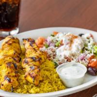 Chicken Shish Kabob Plate · Marinated in house seasoning. Served with basmati rice, greek salad and your choice of spicy...