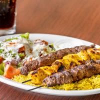 Trio Kabob Combination Plate · Marinated in house seasoning. Served with basmati rice, greek salad and your choice of spicy...