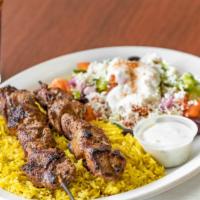 Lamb Shish Kabob Plate · Marinated in house seasoning. Served with basmati rice, greek salad and your choice of spicy...