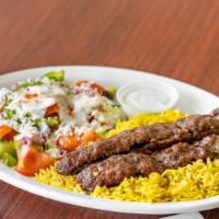 Kafta Kabob Plate · Marinated in house seasoning. Served with basmati rice, greek salad and your choice of spicy...
