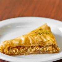Baklava · Delicate layers of filo pastry filled with walnuts and pistachios moistened with a light sug...