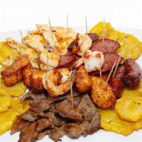 Picada Guatelinda / Guatelinda Platter · Chicken, shrimp, fried cheese, green plantain, salami & steak. Pollo, camarones, queso frito...