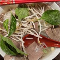 Chin Nam Gan Sach · Slices of well-done flank, brisket, soft tendon and bible tripe with rice noodles.
