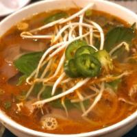 Bun Bo Hue · (Hot & Spicy) Vermicelli noodles with slices of brisket in a hot spicy lemon grass broth.