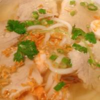 Banh Canh Tom Thit · Udon noodles with shrimp and lean sliced pork topped with fried shallots, cilantro and scall...