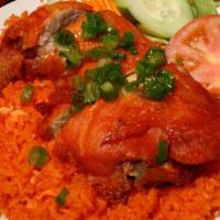 Maryland Chicken · Crispy fried quarter chicken leg served with seasoned tomato rice (or steamed rice) and a si...