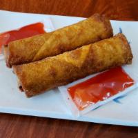 Egg Rolls (2) · Two pieces of deep-fried egg rolls that come with sweet n' sour sauce packets.