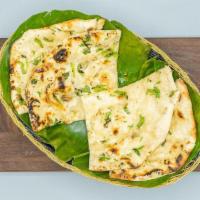 Garlic Naan · Aromatic and scrumptious, leavened, tandoor-baked white bread of refined white flour, topped...