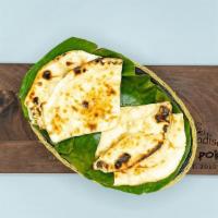 Butter Naan · Delicious and supple leavened white bread made with refined white flour, baked in tandoor ov...