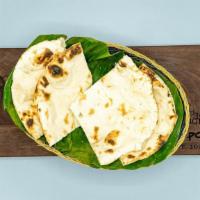 Plain Naan · Delicious and soft leavened white bread resembling a pita bread, baked in tandoor or clay ov...