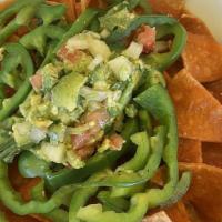 Vegan Chilaquiles · Green or red sauce. Bell pepper, onions and guacamole or vegan chorizo.