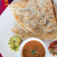 Gringa · Giant quesadilla folded in a flour tortilla, with sliced pastor pork and Oaxaca cheese, acco...