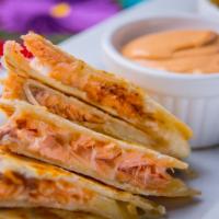 Chilpotle Smoked Salmon Quesadillas · House-made flour tortillas filled with chilpotle smoked salmon, melted cotija and Chihuahua ...