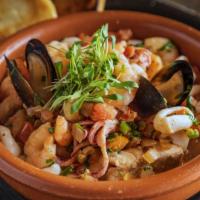 Mariscada A La Mexicana · Gulf shrimp, fresh calamari, crawfish tails, mussels and red snapper sautéed with onions, pe...