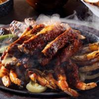 Parrilla Mixta Deluxe · Sizzling charbroiled beef fajitas, chicken breast, butterflied grilled jumbo gulf shrimp, gu...