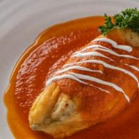 Chile Relleno · Roasted poblano pepper stuffed with your choice of beef picadillo or cotija cheese covered w...