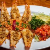 Camarones Al Mojo De Ajo · Six jumbo gulf shrimp lightly breaded and pan-sautéed in garlic-infused olive oil served wit...