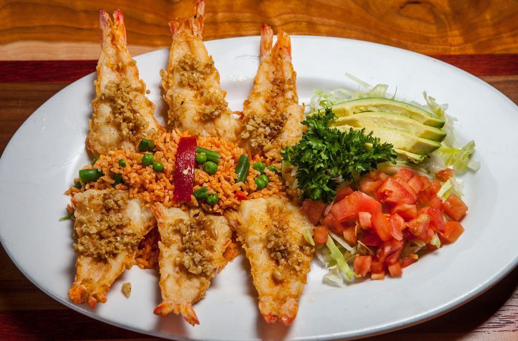 Camarones Al Mojo De Ajo · Six jumbo gulf shrimp lightly breaded and pan-sautéed in garlic-infused olive oil served with Mexican rice, shredded lettuce, tomatoes, avocado slices and tomato habanero salsa.