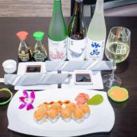 California Dream Sushi · California roll. Topped with fresh shrimp, crab, masago, and mixed in a spicy sauce. Fully c...
