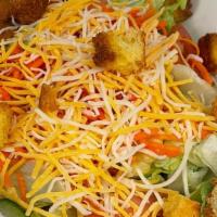 Big House Salad · Iceberg and romaine lettuce, carrots, cucumbers, tomato, cheddar cheese and cornbread crouto...
