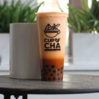 Thai Milk Tea · Cold brew thai tea with organic milk of your choice!