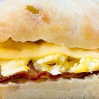 Bacon Egg Breakfast Sandwich · Handcrafted egg patty, locally baked artisan ciabatta roll with Swiss and bacon