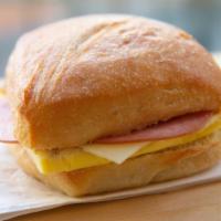Ham And Cheese Breakfast Sandwich · Handcrafted egg patty, locally baked artisan ciabatta roll with swiss and ham.