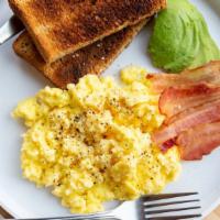 Breakfast Scramble · Scrambled eggs, bacon and avocado served with a slice of our locally baked whole wheat bread